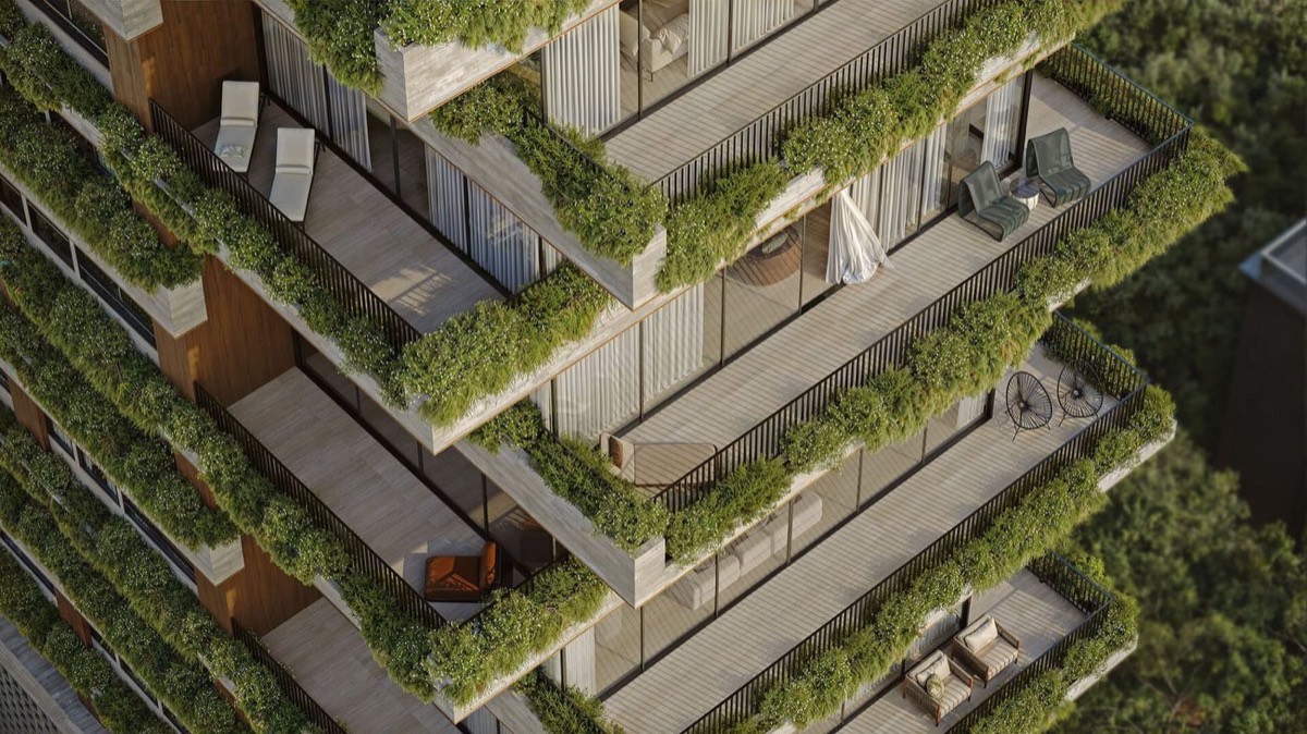 Detalhe das varandas do edificio, com jardineiras corridas e vegetacao em cada pavimento